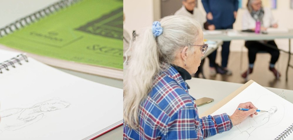 woman drawing a picture of another woman
